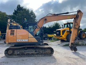 2018 Case CX130D excavator with a long arm and tracks, positioned on a gravel surface.